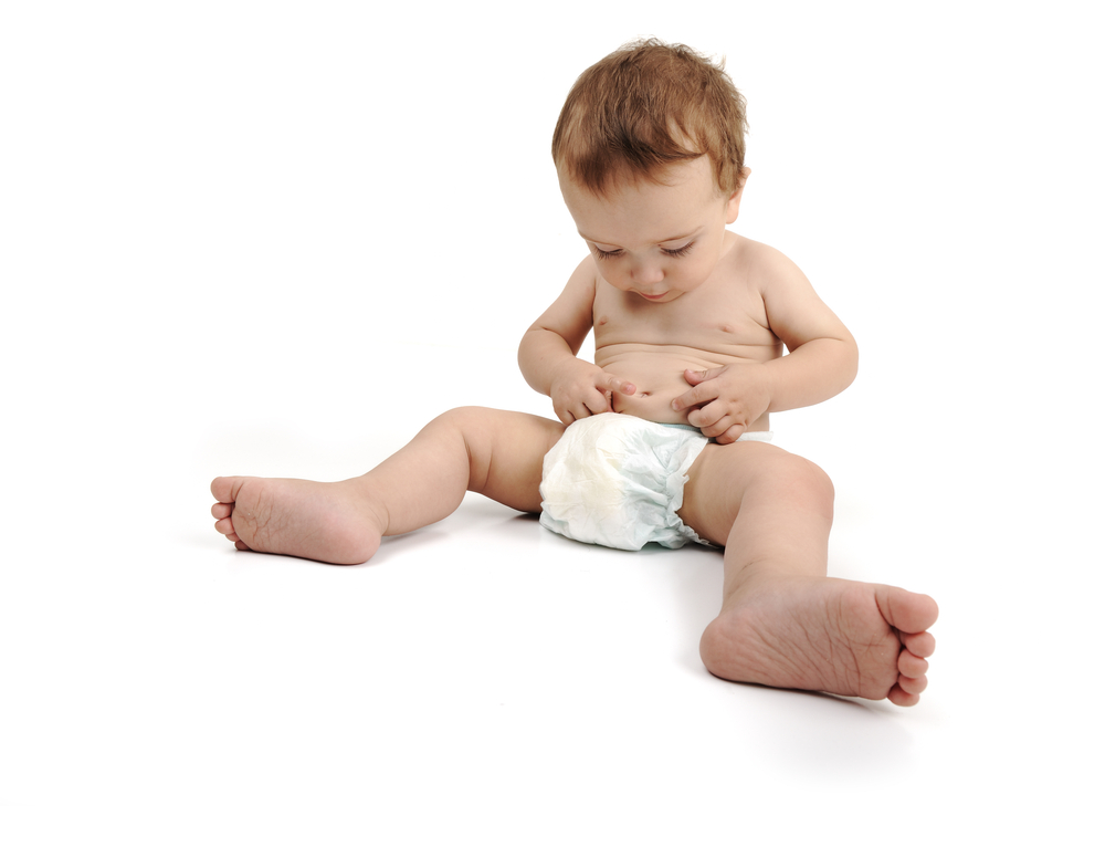 Beautiful cute happy baby isolated on white background. Wearing diaper, large copy-space for your message.